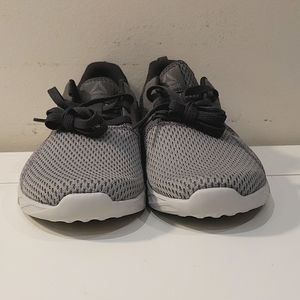 Brand new grey running shoes made by Reebok.